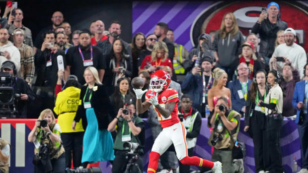 Feb 11, 2024; Paradise, Nevada, USA; Kansas City Chiefs wide receiver Mecole Hardman Jr. (12) makes a game-winning catch for a touchdown against the San Francisco 49ers during overtime of Super Bowl LVIII at Allegiant Stadium.