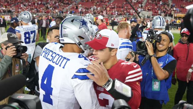 Oct 8, 2023; Santa Clara, California, USA; Dallas Cowboys quarterback Dak Prescott (4) and San Francisco 49ers quarterback Brock Purdy (center right) embrace after the game at Levi's Stadium.