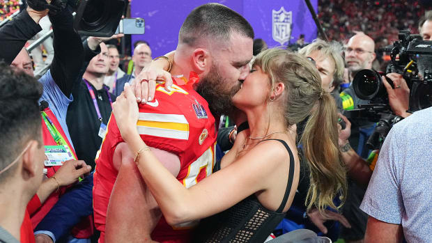 Taylor Swift and Travis Kelce kiss after the Kansas City Chiefs won Super Bowl LVIII in Las Vegas.