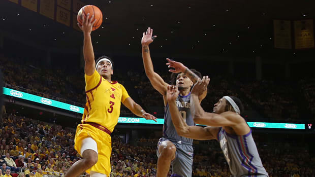 Iowa State Cyclones guard Tamin Lipsey (3) lays up the ball around TCU Horned Frogs guard Avery Anderson III (3) and forward Emanuel Miller (2) during the second half in the Big-12 conference showdown of a NCAA college basketball at Hilton Coliseum on Saturday, Feb. 10, 2024, in Ames, Iowa.