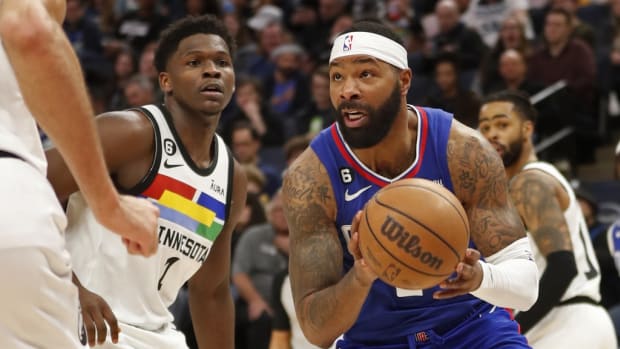 Jan 6, 2023; Minneapolis, Minnesota, USA; Los Angeles Clippers forward Marcus Morris works to the basket past Minnesota Timberwolves forward Anthony Edwards (1) in the third quarter at Target Center.