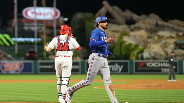 May 6, 2023; Anaheim, California, USA; Texas Rangers left fielder Bubba Thompson (8) gestures after scoring in the ninth inning against the Los Angeles Angels at Angel Stadium.