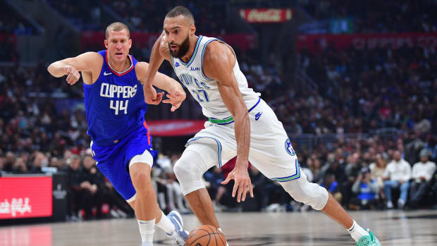 Feb 12, 2024; Los Angeles, California, USA; Minnesota Timberwolves center Rudy Gobert (27) moves to the basket against Los Angeles Clippers center Mason Plumlee (44) during the first half at Crypto.com Arena.