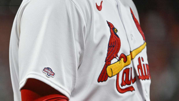 A St. Louis Cardinals player wears a home jersey during a game.
