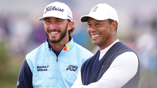 Tiger Woods and Max Homa smile during day one of the 2022 British Open at the Old Course at St. Andrews.