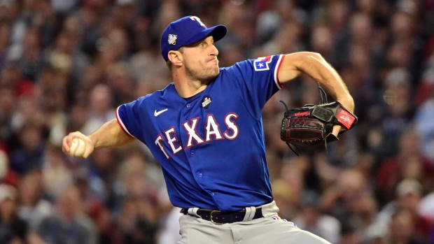Texas Rangers starting pitcher Max Scherzer (31) pitches in the third inning against the Arizona Diamondbacks in Game d of the 2023 World Series at Chase Field.