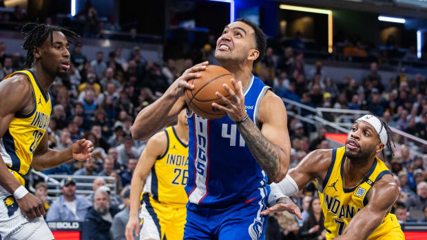 Feb 2, 2024; Indianapolis, Indiana, USA; Sacramento Kings forward Trey Lyles (41) shoots the ball while Indiana Pacers guard Buddy Hield (7) defends in the second half at Gainbridge Fieldhouse. Mandatory Credit: Trevor Ruszkowski-USA TODAY Sports  