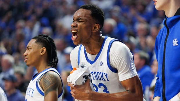 Feb 13, 2024; Lexington, Kentucky, USA; Kentucky Wildcats forward Ugonna Onyenso (33) celebrates from the bench during the first half against the Ole Miss Rebels at Rupp Arena at Central Bank Center. Mandatory Credit: Jordan Prather-USA TODAY Sports