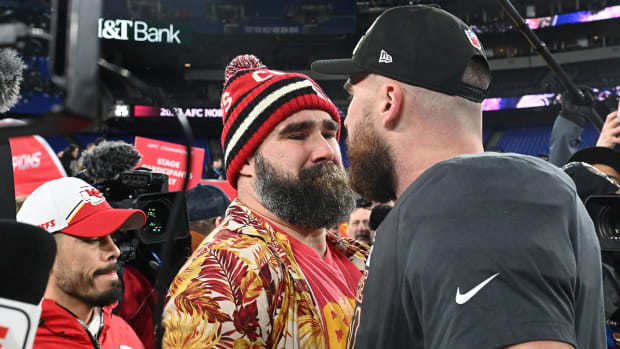 Kansas City Chiefs tight end Travis Kelce (87) celebrates with Jason Kelce (center) after the Kansas City Chiefs won the AFC Championship football game against the Baltimore Ravens at M&T Bank Stadium. 
