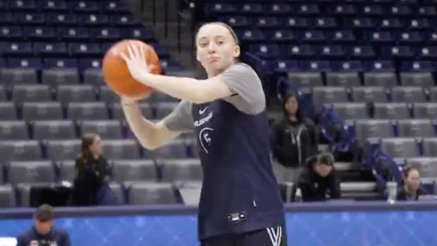 UConn’s Paige Bueckers takes a no-look shot from half-court