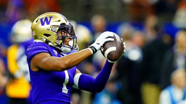 Washington Huskies wide receiver Rome Odunze (1) warms up before playing against the Texas Longhorns in the 2024 Sugar Bowl college football playoff semifinal game at Caesars Superdome.