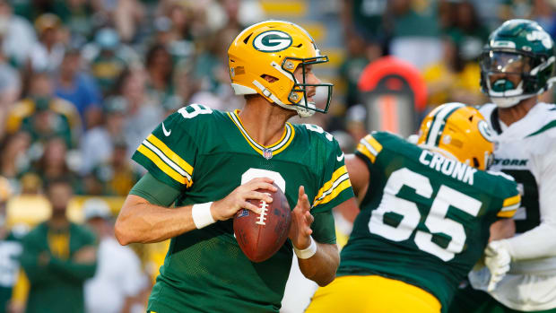 Aug 21, 2021; Green Bay, Wisconsin, USA; Green Bay Packers quarterback Jake Dolegala (9) drops back to pass during the fourth quarter against the New York Jets at Lambeau Field. Mandatory Credit: Jeff Hanisch-USA TODAY Sports  