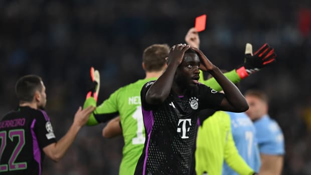 Dayot Upamecano pictured with his hands on his head after being shown a red card during Bayern Munich's 1-0 defeat at Lazio in the UEFA Champions League in February 2024