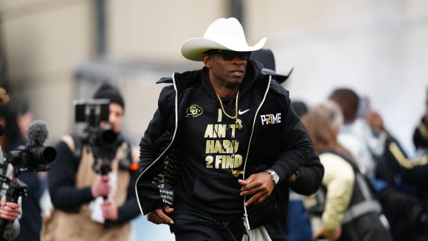 Colorado Buffaloes head coach Deion Sanders hits the field before the start of the spring game at Folsom Field