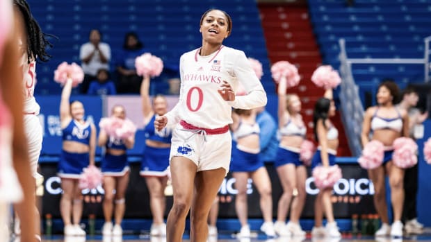 Kansas guard Wyvette Mayberry runs down the court after a play during the game against the Cincinnati Bearcats in  Allen Fieldhouse on February 14, 2024.