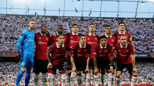 A Manchester United team photo taken in April 2023 before an away game against Sevilla in the UEFA Europa League