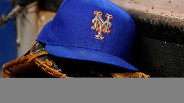 Jul 13, 2019; Miami, FL, USA; A general view of a New York Mets hat and glove on the steps of the dugout in the game between the Miami Marlins and the New York Mets at Marlins Park. Mandatory Credit: Jasen Vinlove-USA TODAY Sports