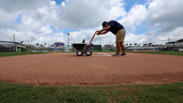 Mar 13, 2023; Fort Myers, Florida, USA; the Minnesota Twins grounds crew gets the field ready for a game against the New York Yankees during spring training at Hammond Stadium.