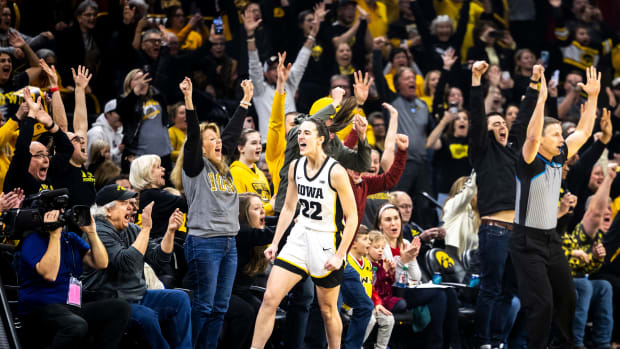Iowa guard Caitlin Clark (22) reacts after making a 3-point basket setting the record for all-time leading scoring during a NCAA Big Ten Conference women's basketball game against Michigan, Thursday, Feb. 15, 2024, at Carver-Hawkeye Arena in Iowa City, Iowa.