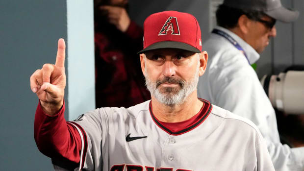 Torey Lovullo gestures after defeating Dodgers 4-2 in game 2 of the NLDS