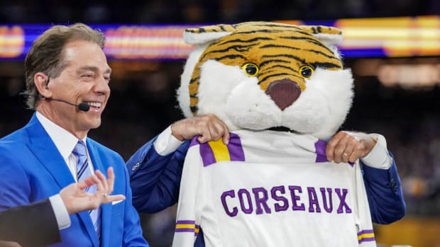 Nick Saban appears on ESPN’s ‘College GameDay’ next to Lee Corso, who is wearing LSU mascot Mike the Tiger’s head.