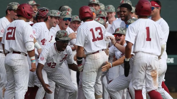 Alabama players celebrate during an exhibition game on Oct. 28, 2023.