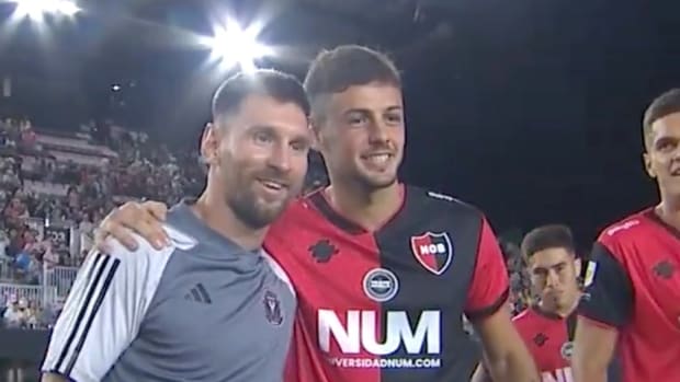 Lionel Messi pictured (left) posing for a photograph with Ian Glavinovich following a 1-1 draw between Inter Miami and Newell's Old Boys in Florida in February 2024