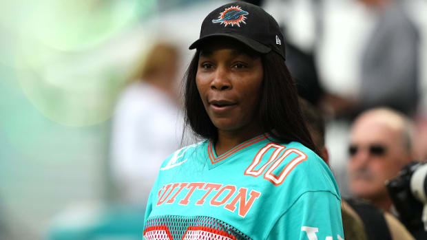 Venus Williams stands on the field prior to the game between the Miami Dolphins and the Dallas Cowboys.