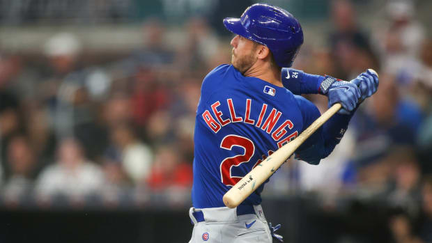 Chicago Cubs first baseman Cody Bellinger (24) hits a single in the second inning of a game against the Atlanta Braves.