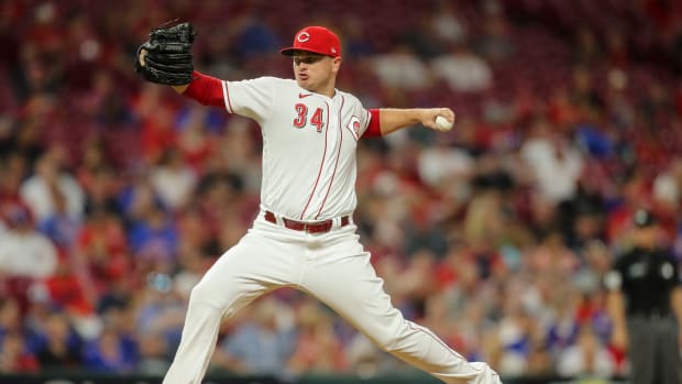Aug 17, 2021; Cincinnati, Ohio, USA; Cincinnati Reds relief pitcher Justin Wilson (34) throws a pitch against the Chicago Cubs in the seventh inning at Great American Ball Park.