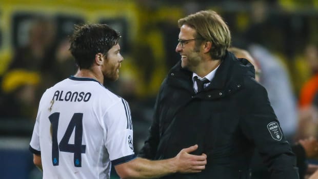 Jurgen Klopp (right) and Xabi Alonso pictured in 2012 following a Champions League game between Borussia Dortmund and Real Madrid