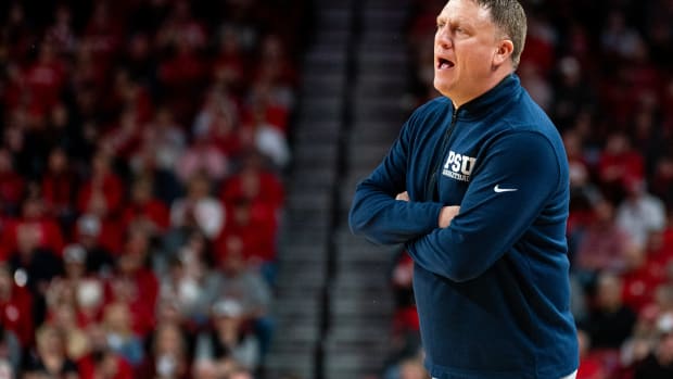 Penn State men's basketball coach Mike Rhoades instructs his team during a Big Ten game at the Nebraska Cornhuskers.