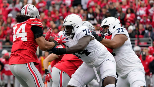 Oct 21, 2023; Columbus, Ohio, USA; Ohio State Buckeyes defensive end JT Tuimoloau (44) goes up against Penn State Nittany Lions offensive lineman Olumuyiwa Fashanu (74) during the third quarter of their game at Ohio Stadium.