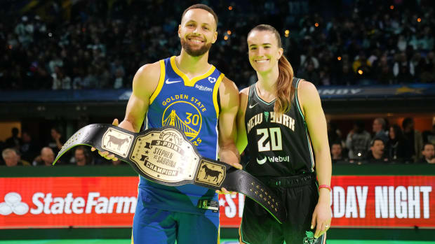 Golden State Warriors guard Stephen Curry (30) and New York Liberty guard Sabrina Ionescu (20) after the Stephen vs Sabrina three-point challenge during NBA All Star Saturday Night.