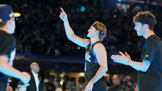 Feb 17, 2024; Indianapolis, IN, USA; Osceola Magic guard Mac McClung (0) reacts after dunking the ball during the slam dunk competition during NBA All Star Saturday Night at Lucas Oil Stadium.