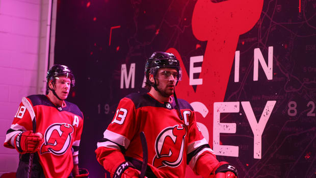 New Jersey Devils center Nico Hischier (13) walks to the locker room after the Devils win over the New York Islanders at Prudential Center.