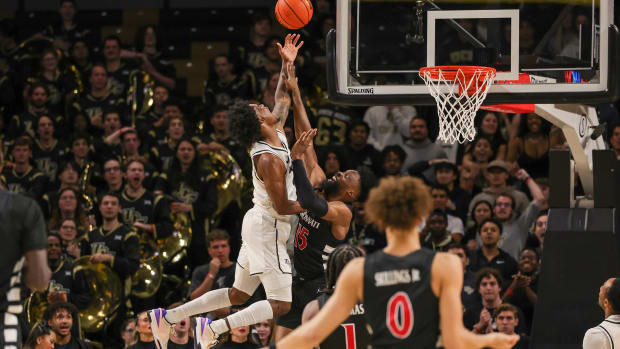 Feb 17, 2024; Orlando, Florida, USA; UCF Knights guard Jaylin Sellers (24) goes to the basket against Cincinnati Bearcats forward John Newman III (15) during the first half at Addition Financial Arena. Mandatory Credit: Mike Watters-USA TODAY Sports