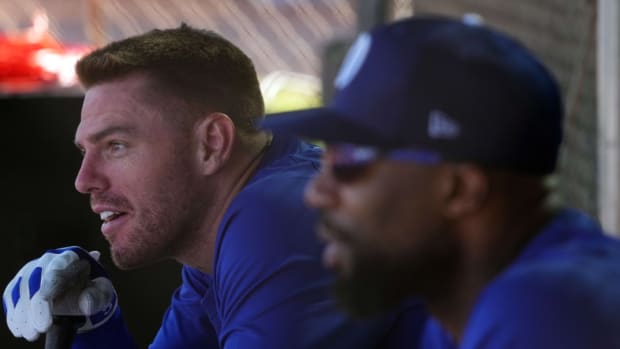 Feb 15, 2024; Glendale, AZ, USA; Los Angeles Dodgers first baseman Freddie Freeman (left) and Los Angeles Dodgers right fielder Jason Heyward (23) look on during a Spring Training workout at Camelback Ranch.