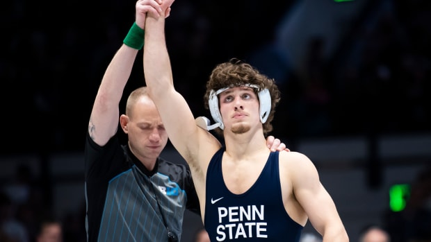 Penn State's Levi Haines gets his hand raised after winning at 157 pounds against Ohio State in a Big Ten Conference wrestling match at Rec Hall.