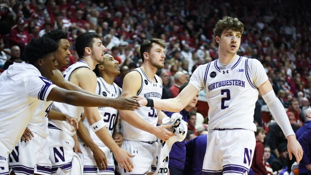 Northwestern Wildcats forward Nick Martinelli (2) celebrates with the bench after a play against the Indiana Hoosiers during the second half at Simon Skjodt Assembly Hall.