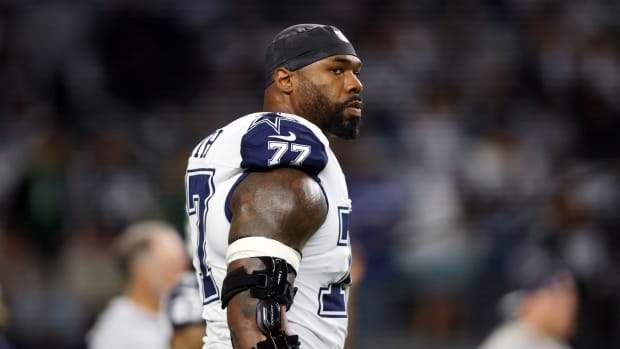 Dec 10, 2023; Arlington, Texas, USA; Dallas Cowboys offensive tackle Tyron Smith (77) on the field before the game against the Philadelphia Eagles at AT&T Stadium. Mandatory Credit: Tim Heitman-USA TODAY Sports