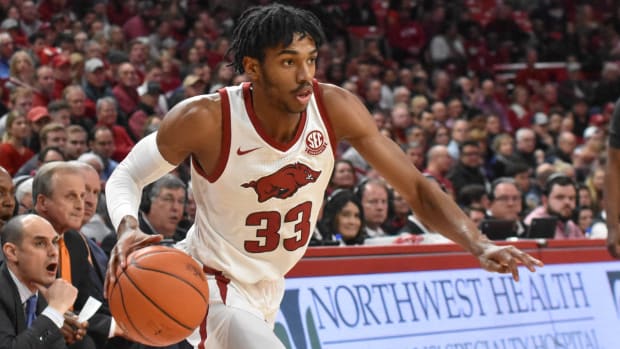 Razorbacks' Jimmy Whitt driving in a game from 2020