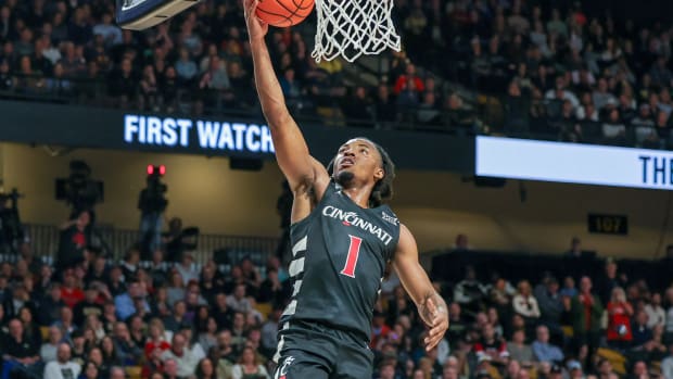 Feb 17, 2024; Orlando, Florida, USA; Cincinnati Bearcats guard Day Day Thomas (1) goes to the basket during the first half against the UCF Knights at Addition Financial Arena. Mandatory Credit: Mike Watters-USA TODAY Sports