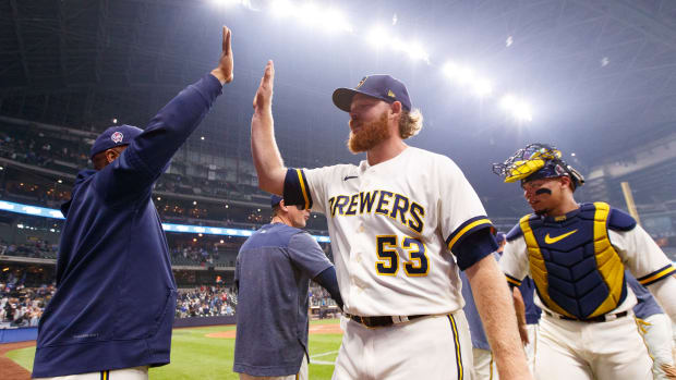 Sep 11, 2023; Milwaukee, Wisconsin, USA; Milwaukee Brewers pitcher Brandon Woodruff (53) high fives teammates following the game against the Miami Marlins at American Family Field.
