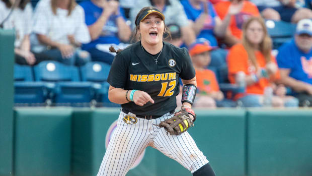 Missouri infielder Katie Chester (12) makes an out at first during game two of a doubleheader with Florida taking on Missouri Friday, March 17, 2023, at Pressly Stadium in Gainesville, Fla.