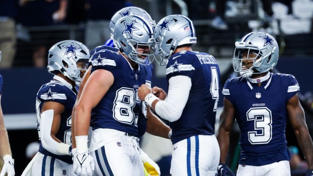 Oct 29, 2023; Arlington, Texas, USA; Dallas Cowboys tight end Jake Ferguson (87) celebrates with Dallas Cowboys quarterback Dak Prescott (4) after catching a touchdown pass during the first quarter against the Los Angeles Rams at AT&T Stadium.