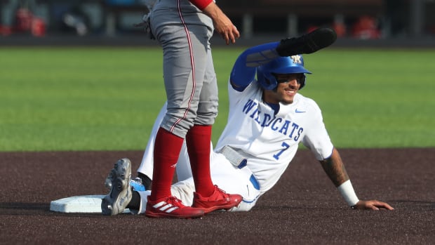 UK's Devin Burkes (7) smiled at the dugout as he was safe at second against Indiana during the NCAA Regional final in Lexington Ky. on June 5, 2023.