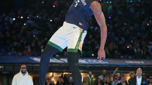 Feb 17, 2024; Indianapolis, IN, USA; Boston Celtics guard Jaylen Brown (7) dunks the ball during the slam dunk competition during NBA All Star Saturday Night at Lucas Oil Stadium. Mandatory Credit: Kyle Terada-USA TODAY Sports