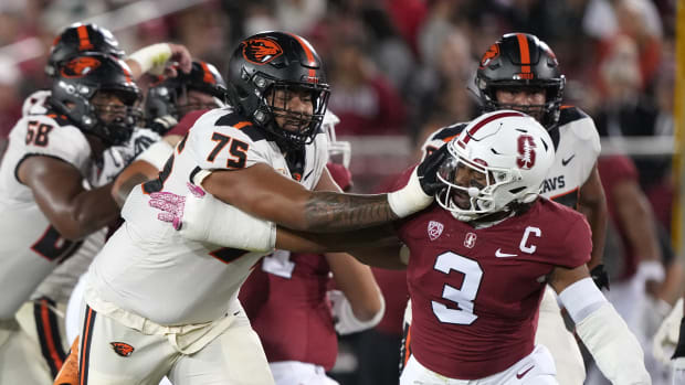 Oregon State Beavers offensive lineman Taliese Fuaga (75) blocks Stanford Cardinal linebacker Levani Damuni (3) during the first quarter at Stanford Stadium.