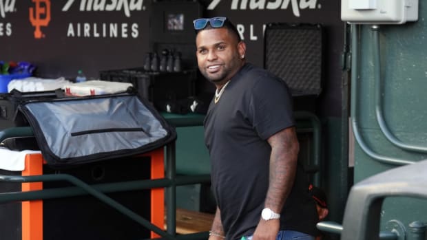 Aug 25, 2023; San Francisco, California, USA; San Francisco Giants former third baseman Pablo Sandoval stands in the dugout before the game against the Atlanta Braves at Oracle Park.